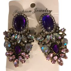 Purple And “Crystal” Stones. Pierced. Nwot. Purple Rhinestone Crystal Earrings For Party, Purple Jewelry With Sparkling Stones For Party, Purple Rhinestone Earrings For Party, Party Purple Crystal Rhinestone Earrings, Purple Rhinestone Party Earrings, Glamorous Purple Jewelry For Evening, Purple Party Jewelry, Purple Drop Crystal Earrings For Evening, Purple Crystal Drop Earrings For Evening