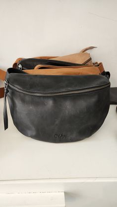 New! Large size for the fannypack a Beautiful fanny pack bag in a Large size, Made from soft premium Italian leather in Ash Black color in Distressed leather finish . perfect as your daily small bag for hands-free carrying, This accessory makes hearts skip a beat. a fashion forward bag that's trendy, unisex and functional ◄ DIMENSIONS ► Height: 32 cm / 12" Width: 23 cm / 8.8" Features► * Adjustable cross body / waist strap * Fully lined * 1 inside zippered pocket * 1 Outer zippered pocket * YKK Casual Leather Belt Bag With Zipper Pouch, Modern Leather Belt Bag With Zipper Pouch, Black Zipper Pouch Belt Bag For Everyday Use, Black Belt Bag With Zipper Pouch For Everyday Use, Crossbody Fanny Pack, Women Sling Bag, Belly Bag, Fanny Pack Women, Cross Shoulder Bags