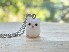 This white cat glass beads necklace is cute and dainty, which are perfect gifts for kids and friends.  They are made of the following: 🔹 Handmade glass beads: H13 x W10 x D12mm (0.5-1mm variation).  Each bead is unique so there is a slightly different from bead to bead. 🔹 Necklace chain: gold / silver plated over brass 🔹 Necklace Length: choose the exact length of the chain (the length includes clasp and findings).   【PLEASE NOTE THE FOLLOWINGS BEFORE PURCHASE】 ✔ VAT, GST and any other taxes Cute White Nickel Free Necklaces, Cute White Nickel-free Necklaces, Handmade White Kawaii Jewelry, Kawaii White Jewelry For Gifts, White Handmade Kawaii Jewelry, Whimsical White Necklaces For Gifts, Whimsical White Necklace For Gift, Whimsical White Necklace Perfect For Gifts, Handmade White Kawaii Necklace