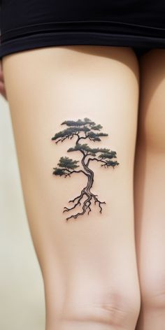 A minimalist, aesthetic bonsai tattoo graces the thigh, embodying the wearer's respect for nature. Check out our 'TreeTee' Etsy shop, where each tee bought supports our tree-planting mission, fostering a more sustainable world together. Future Tattoo Ideas, Tattoo On The Thigh, Bonsai Tattoo, Tattoos For Baby Boy, Bonsai Tree Tattoos, Korea Tattoo, Hippie Tattoo, Finger Tats, Cool Tattoo