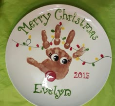 a plate with a handprint on it that says merry christmas evelyp 2013