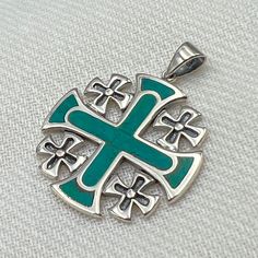 "King Solomon Jerusalem Cross / Eilat Stone Jerusalem Cross Pendant (Silver 925) The Jerusalem Cross: The Unique design of the Jerusalem cross has three different explanations: 1. The first explanation is that the Jerusalem cross symbolizes the spread of THE WORD Of GOD from Jerusalem to the rest of the world. The large middle cross represents Jerusalem while the four smaller crosses represent the four corners of the world. 2. The second explanation is that the main cross represents the Holy Spi Sterling Silver Cross Pendant With Polished Finish, Sterling Silver Polished Cross Pendant Jewelry, Luxury Sterling Silver Cross Pendant Jewelry, Green Spiritual Jewelry With Polished Finish, Green Sterling Silver Jewelry With Polished Finish, Symbolic Green Sterling Silver Jewelry, Green Symbolic Sterling Silver Jewelry, Green Spiritual Cross Pendant Jewelry, Handmade White Gold Cross Pendant