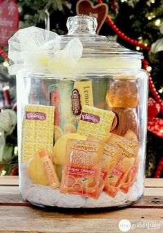 a glass jar filled with different types of candies