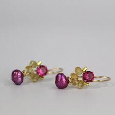 These handcrafted dancer earrings are petite, delicate and whimsical. The unique copper bezel setting showcases a bright pink corundum zircon. Beautiful and elegant citrine gemstones are hand woven and a lovely pink pearl dangles gently. These romantic and colorful dancer earrings seem to come straight from a fairytale!They're the perfect pair of earrings to give your special someone! The hook is made of gold filled. The earring's hook can be made with sterling silver or solid gold incase of all Pink Briolette Earrings As Gift, Pink Briolette Earrings For Gift, Pink Briolette Earrings For Pierced Ears, Unique Pink Ruby Jewelry, Unique Pink Jewelry For Celebration, Pink Wedding Earrings With Birthstone, Pink Ruby Drop Earrings, Unique Pink Gemstone Earrings, Handmade Pink Fine Jewelry Earrings