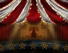 a stage with red curtains and stars on the floor