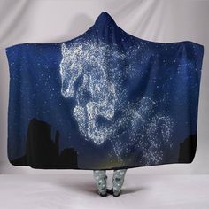 a hooded blanket with the image of a horse on it's head and stars in the sky