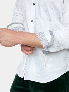 An understated elegance to this solid white button down creates a style that is Simply Grand. Oversized paisleys are elevated by tonal embroidery throughout, and jacquard at the inside yoke adds polish. Swap out your basic white shirt and layer under a blazer, or wear solo and let this piece shine. Point collar Full button front placket Large paisley pattern Schiffli hand embroidery Jacquard at inside yoke Contrast print at collar and cuff Long sleeve Button cuff Shirttail hem 100% cotton Machin Basic White Shirt, Flare Jeans Shoes, Kimono Outerwear, Tonal Embroidery, Maxi Jumpsuit, Cap Fashion, White Button Down, Retro Shirts, Understated Elegance