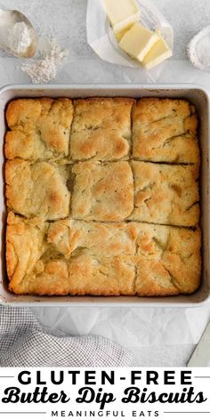 gluten - free butter dip biscuits in a baking pan with butter on the side