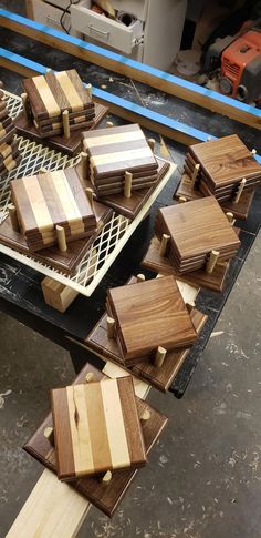 several pieces of wood sitting on top of a table next to a wire grate