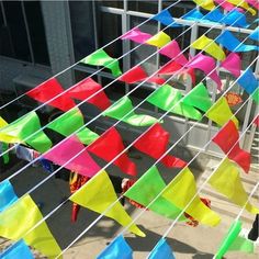 many colorful kites are flying in the air