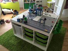 a toy table with legos on it in a child's room