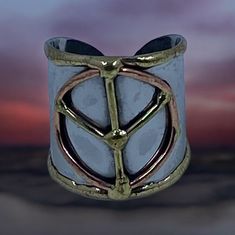 Embrace peace with our exquisite, adjustable stainless steel cuff rings.  The timeless peace symbol conveys a powerful message of unity and harmony.  Perfect for both men and women, our cuffs are designed to make a statement and fit effortlessly.  Shop now to enjoy a 10% discount on purchases over $50 (use code FREESHIPDOM2) and receive free domestic shipping.  Subscribe to our newsletter at http://eepurl.com/dEBXqb and join our community for exclusive deals and updates. Join us in advocating for world peace today! Take advantage of this limited-time offer - shop now and join our community for exclusive deals and updates. Adjustable Symbolic Metal Rings, Adjustable Spiritual Jewelry With Peace Sign, Cuff Ring, Cuff Rings, World Peace, Rings Statement, Peace Symbol, Over 50, Statement Rings