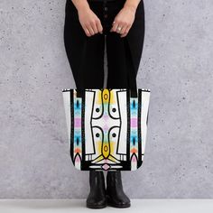 Small abstract Tote bag,  bright colourful canvas bag, long handled bag, nice casual tote bag The bag in the image is a vibrant and stylish tote featuring a modern, abstract design. The design consists of bold, black-and-white geometric shapes, accented with pops of bright colors like yellow, blue, and pink. The pattern appears symmetrical, creating an artistic and eye-catching look. The bag's red strap contrasts beautifully with the colorful pattern, adding a bold touch to the overall bag. ### Trendy Multicolor Canvas Bags, Modern White Canvas Shoulder Bag, Modern Square Canvas Bag For Shopping, Modern Square Canvas Shopping Bag, Modern White Canvas Bag, Modern White Rectangular Canvas Bag, White Cotton Modern Bags, Modern White Cotton Bag, Trendy Multicolor Canvas Bag For Everyday