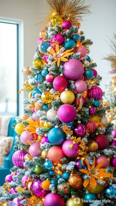 a brightly colored christmas tree with ornaments