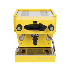 a yellow coffee machine sitting on top of a counter