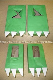 four pieces of green paper that are shaped like alligator's mouths and feet, with one piece cut out to look like a crocodile's mouth