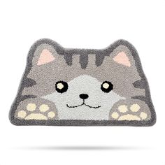 a gray cat rug with paws on it