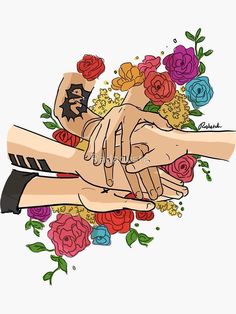 two hands holding each other with flowers in the background and tattoos on their arms behind them