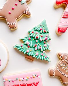 decorated christmas cookies on a white surface