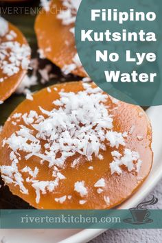 some food is on a white plate and there are coconut flakes on top of it