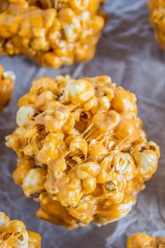 caramel popcorn balls on a piece of parchment paper