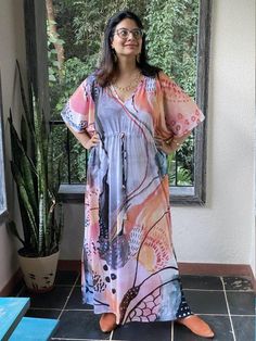 This is our "Timeless" style kaftan. It features a drawstring that you can cinch at the waist. This loose fitting Caftan House dress is exceptionally comfortable and stylish.I created a short video about this stylehttps://youtu.be/UBoXhg49XxQAs for the fabric pattern, we have used a hand drawn and digitally painted technique. So they are all unique designs. It is like wearing wearable art. What I love about digital paintings is that they look as beautiful as the hand paintings but the care neede Kaftan Styles, Hand Paintings, Bridesmaid Pjs, Digital Paintings, House Dress, Fabric Pattern, Long Maxi, Dressed Down, Long Maxi Dress