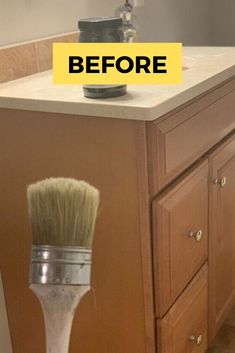 a paint brush sitting on top of a bathroom counter