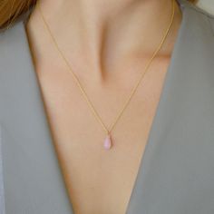 "Sweet and gentle Natural Pink Opal drop necklace suspended from a delicate chain. For a special gift for wife on the 14th Anniversary or October Birthday. Matching earrings available here: https://etsy.me/38LqRtU M A T E R I A L S: * natural pink opal * 14k Gold Filled / 14k Rose Gold Filled / Sterling Silver * spring ring clasp closure * personalized disc with BB letters on the chain end or ->Your initials * comes in our beautiful branded gift box along with the descriptive gemstone card S Dainty Teardrop Charm Necklace, Delicate Teardrop Pendant Charm Necklace With Clavicle Chain, Charm Necklace With Adjustable Chain And Teardrop Pendant, Dainty Crystal Necklace With Teardrop Pendant On Delicate Chain, Delicate Drop Necklace With Clavicle Chain, Teardrop Pendant Charm Necklace For Wedding, Feminine Teardrop Pendant Necklace, Gold Teardrop Crystal Necklace, Delicate Teardrop Crystal Necklace