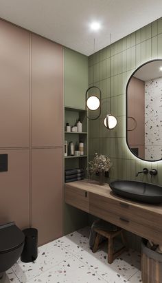 a bathroom with a sink, mirror and lights on the wall next to a toilet