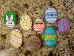 painted rocks with the words happy easter written on them