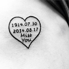 a heart tattoo with the date and year on it