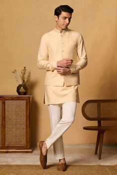 Yellow bundi with thread embroidered floral motifs and placed sequin bead embellishments. Comes with inner kurta and pant. - Aza Fashions Nehru Jacket With Floral Embroidery For Reception And Festivals, Floral Embroidered Nehru Jacket For Reception And Festivals, Floral Embroidered Nehru Jacket For Festivals And Receptions, Festival Nehru Jacket With Floral Embroidery For Reception, Bandhgala With Chikankari Embroidery For Eid, Eid Bandhgala With Chikankari Embroidery And Stand Collar, Festive Nehru Jacket With Floral Embroidery And Stand Collar, Ceremonial Nehru Jacket With Chikankari Embroidery, Festive Stand Collar Kurta With Floral Embroidery