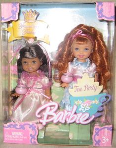 two dolls are shown in the box