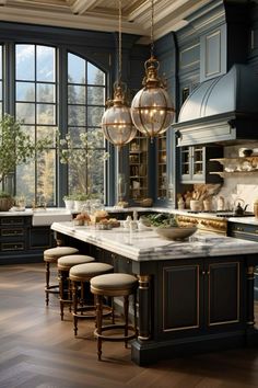 a large kitchen with an island and lots of counter space in front of the windows