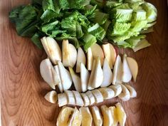 chopped apples and lettuce on a cutting board