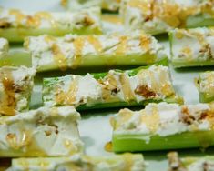 cucumber and cheese appetizers are arranged on a tray