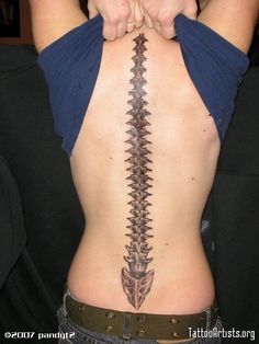 a woman with a tattoo on her back