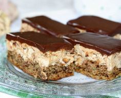 chocolate and peanut butter bars on a glass plate