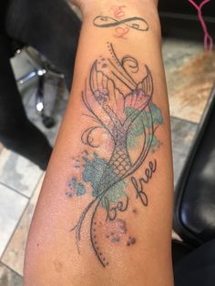 a woman's arm with a tattoo on it that says hope and an image of a fish