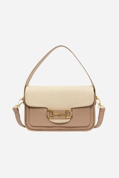 Introducing our Lexi Top Handle Bag - a perfect blend of style and functionality for the modern equestrian. Crafted from premium vegan leather in a warm & neutral palette, this versatile purse transitions effortlessly from a chic crossbody to a grab-on-the-go mini. Featuring an iconic horse bit detail in gold. The top flap opens from the back with a magnetic snap closure. Fully lined interior with substantial main compartment to hold all of your evening and everyday essentials. 8" L x 5" H x 3" Chic Beige Saddle Bag For Travel, Chic Travel Saddle Bag, Chic Beige Saddle Bag, Chic Saddle Bag With Removable Pouch For On-the-go, Trendy Beige Saddle Bag With Detachable Strap, Chic Double Handle Saddle Bag For Practical Use, Beige Saddle Shoulder Bag With Detachable Strap, Chic Saddle Bag With Double Handle For On-the-go, Beige Satchel With Detachable Strap For On-the-go