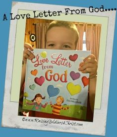 a young boy holding up a sign that says love letter from god