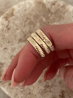 Our initial signet band is an everyday staple, personalized. The perfect way to showcase yourself or someone you love. Not to mention, they make the perfect custom gifts. Modeled with: 2 hammered stacking rings