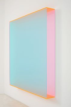 an abstract painting on the wall with blue and pink colors in it's center