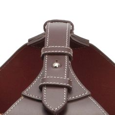 a brown purse with white stitching on it