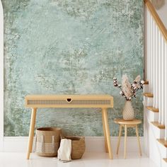 a wooden table sitting next to a white stair case