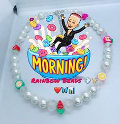 a necklace with an image of a woman in a bowl and the words morning rainbow beads on it