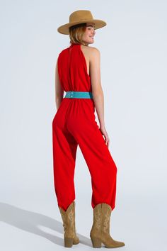 Turn heads with our stunning Red Jumpsuit With Crossed Halter Neckline. Crafted from 100% polyester, this jumpsuit offers a lightweight and comfortable fit, making it perfect for spring and summer events. The jumpsuit features a chic halter neckline that crosses at the top, adding a unique and elegant touch. The wide legs create a flattering silhouette, while the small gap at the stomach adds a modern and stylish flair. The high waist design accentuates your figure, and it can be styled with a belt for an even more defined waistline (belt not included). Key Features: Material: 100% Polyester Fit: Runs true to size, regular fit Details: High collar neckline, sleeveless style, wide leg, high waist, flattering gap at the stomach, zip-back fastening, lightweight woven fabric Model Info: Wearin Spring Halter Neck Jumpsuit Or Romper, Spring Halter Neck Jumpsuit, Red Strapless Jumpsuit For Summer Party, Chic Red Strapless Jumpsuit For Spring, Chic Red Jumpsuits And Rompers For Summer, Red Fitted Strapless Jumpsuit For Summer, Chic Red Overall Jumpsuit, Style For Spring, Beautiful Jumpsuits