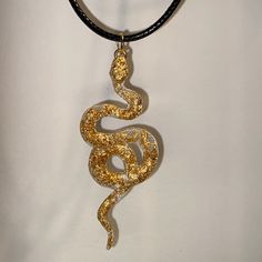 A beautiful handmade snake pendant. A great gift for a loved one or yourself! Each pendant is unique and one of a kind. This necklace is lightweight, durable. The black necklace cord is 45cm in length with a silver lobster claw clasp and 5cm extension chain, you can adjust the length to fit your needs. Other colours available in my store and more coming soon. If you have any request for any specific colour(s) or themes, feel free to contact me and I will see what I can do. :)  Custom orders avai Black Snake Necklace For Gifts, Black Snake Necklace For Gift, Black Snake-shaped Necklaces As Gift, Black Snake Shape Necklace Gift, Black Snake Shape Necklace For Gift, Handmade Snake-shaped Necklace For Gift, Handmade Snake Shape Necklace Gift, Handmade Snake Necklace For Gifts, Handmade Snake Shape Necklace For Gift