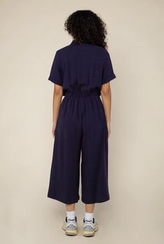 Collared button up short sleeve jumpsuit with wide leg culotte pant and side pockets Be the best-dressed at brunch in our Hope Linen Jumpsuit! This comfy stylish number will take you from AM to PM—collared button-up, wide leg culotte pant, and side pockets make it a no-brainer for the win! Get ready to jump(suit) on the fashion bandwagon! Details • Made in United States • Fabric: 85% Rayon, 15% Linen • Care Instructions: Hand wash • Weight: 8 oz (226.8 g) Beacon Ny, Am To Pm, Short Sleeve Jumpsuit, Culotte Pants, Short Sleeve Jumpsuits, Linen Jumpsuit, Jumpsuit With Sleeves, Sustainable Clothing, Wide Leg Jumpsuit