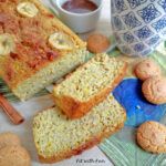 a table topped with lots of different types of breads and muffins next to each other